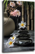 A harmonious black stone stack paired with white and pink flowers bamboo and ceramic vases creates a tranquil Zen decor for minimalist homes and mindful spaces 16x24in Wood Framed