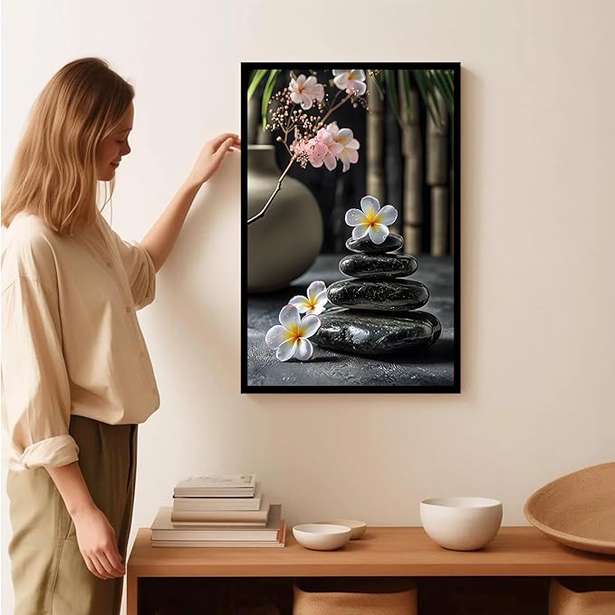 A harmonious black stone stack paired with white and pink flowers bamboo and ceramic vases creates a tranquil Zen decor for minimalist homes and mindful spaces 20x30in Metal blackFramed
