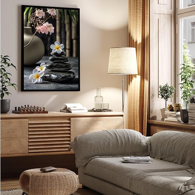 A harmonious black stone stack paired with white and pink flowers bamboo and ceramic vases creates a tranquil Zen decor for minimalist homes and mindful spaces 12x18in Metal blackFramed