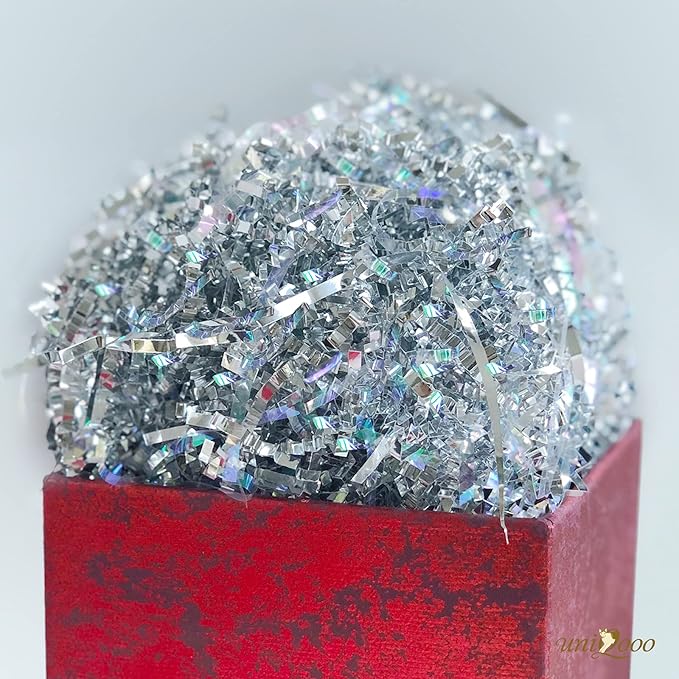 UNIQOOO 1/2 LB Metallic Iridescent Silver Crinkle Cut Paper Shredded Filler, Sparkle Crystal Unicorn Silver Paper Shreds Raffia Tissue, Craft Bedding Cushion, For Christmas Gifts Wedding Birthday