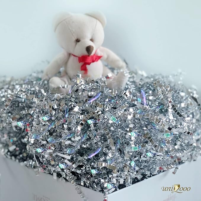 UNIQOOO 1/2 LB Metallic Iridescent Silver Crinkle Cut Paper Shredded Filler, Sparkle Crystal Unicorn Silver Paper Shreds Raffia Tissue, Craft Bedding Cushion, For Christmas Gifts Wedding Birthday